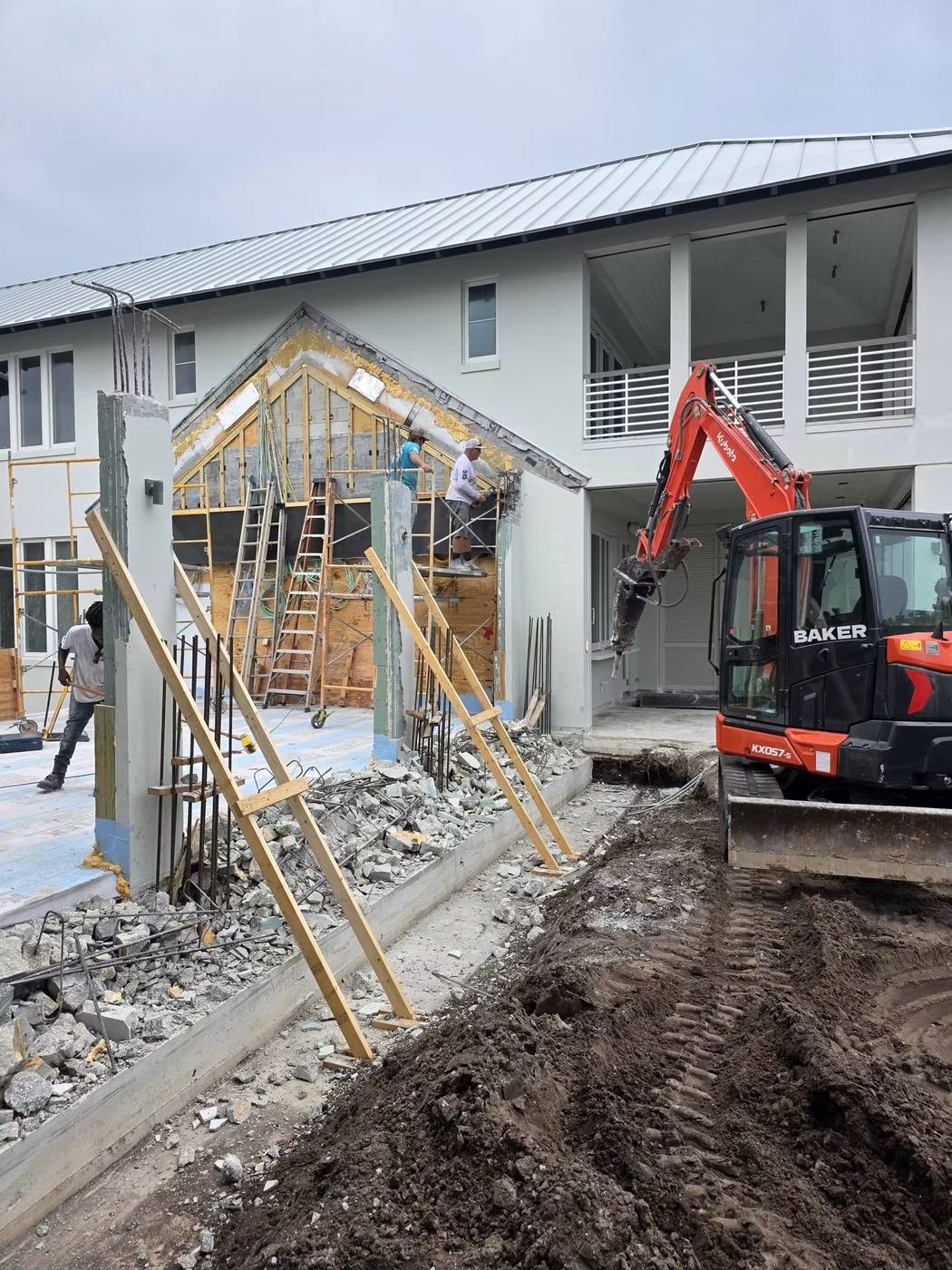 Excavator and fresh trenching during a demolition and site-work project